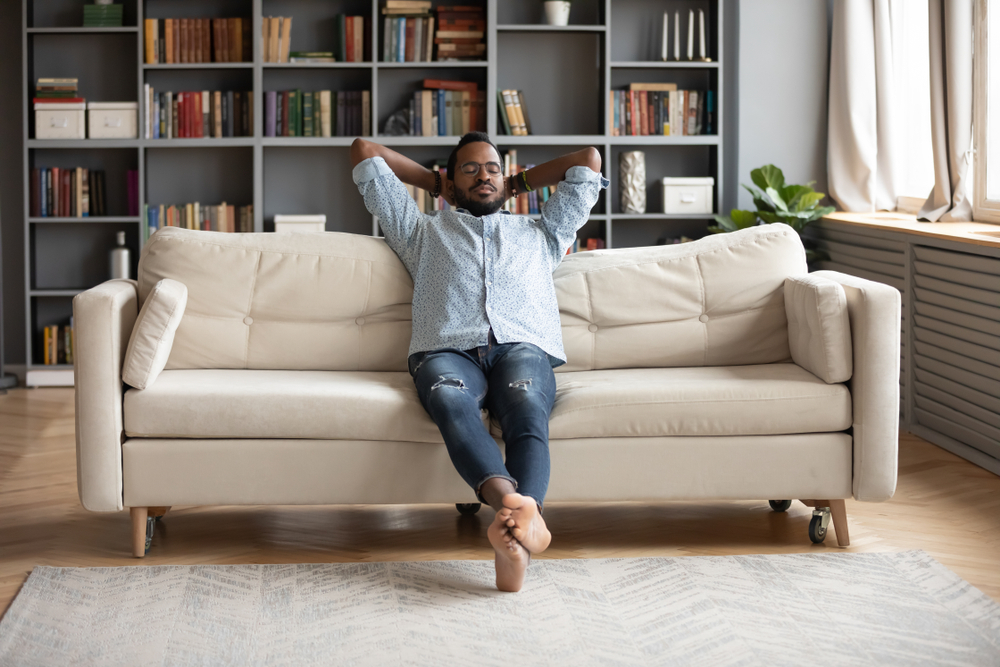 Man sitting quietly on couch